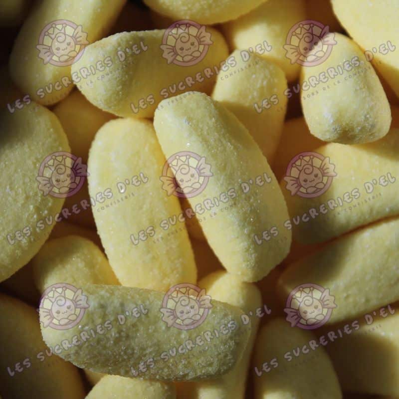 Image de bonbons Banan's Haribo en forme de bananes gélifiées avec une texture croquante et sucrée.