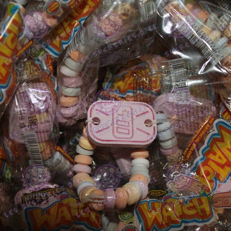Bonbons Montre Watch, montre comestible avec perles et cadran en dextrose, une friandise rétro évoquant les souvenirs d'enfance.